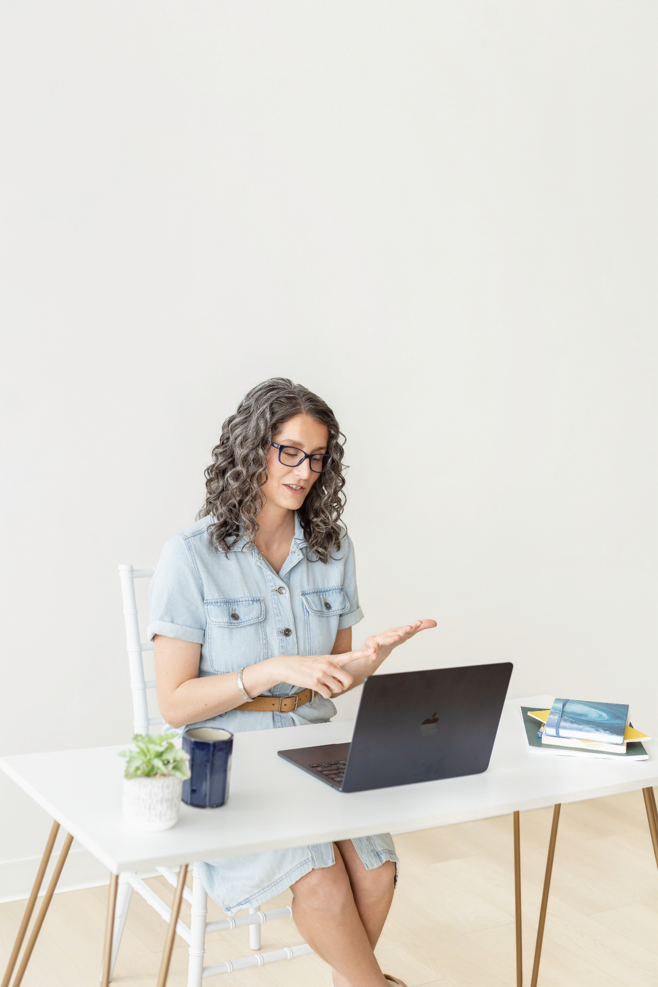 Maria working at her laptop